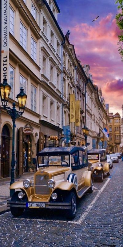 vintage cars on the street in the middle of Prague